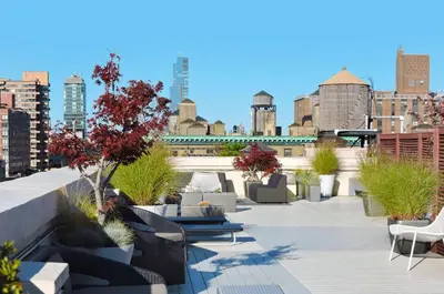 a rooftop patio with a view of a city at UWS 1br w gym doorman nr Central Park NYC-1100 in New York