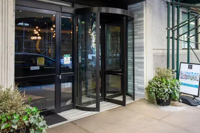 an entrance to a building with revolving doors at UWS 1br w gym doorman nr Central Park NYC-1100 in New York