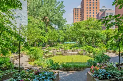 a garden in the middle of a city at UWS 1br w gym doorman nr Central Park NYC-1100 in New York