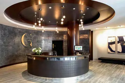 a hotel lobby with a reception desk and a circular ceiling at UWS 1br w gym doorman nr Central Park NYC-1100 in New York