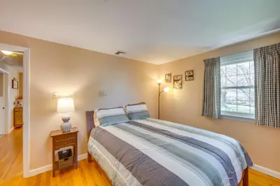 a bedroom with a bed and a window at 10 Mi to Dtwn Lancaster Charming Home with Yard! in Leola