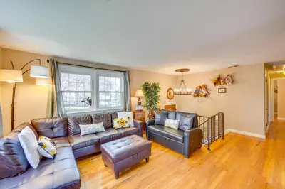 a living room with a couch and a chair at 10 Mi to Dtwn Lancaster Charming Home with Yard! in Leola