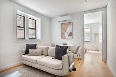 a living room with a couch and a table at SoHo 1br w outdoor space in-unit wd NYC-1143 in New York