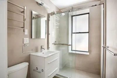 a bathroom with a toilet and a sink and a shower at SoHo 1br w outdoor space in-unit wd NYC-1143 in New York