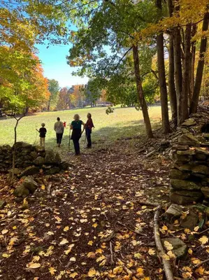 a group of people walking down a path in a park at Catskills Escape - Serenity on 105 Acres, 2 hours from NYC in Ellenville