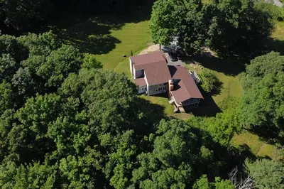 an aerial view of a house in the woods at Catskills Escape - Serenity on 105 Acres, 2 hours from NYC in Ellenville