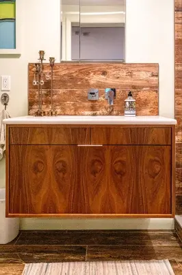 a bathroom with a wooden vanity with a sink at Quiet place with easy access NYC in River Edge