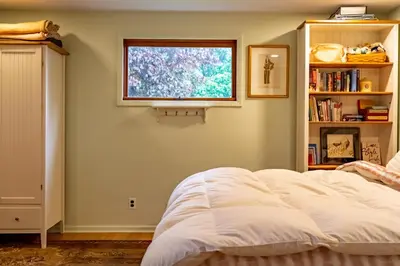 a bedroom with a white bed and a window at Quiet place with easy access NYC in River Edge
