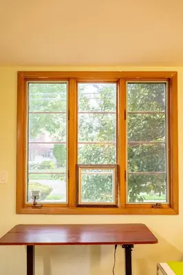two windows in a room with a wooden bench at Quiet place with easy access NYC in River Edge
