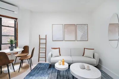 a living room with a couch and a table at 48-5RW 1BR Apartment in Midtown West W D in New York