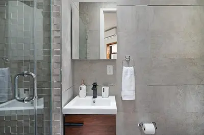 a bathroom with a sink and a mirror at 48-5RW 1BR Apartment in Midtown West W D in New York