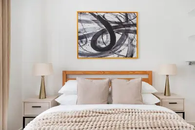a bedroom with a large bed with two lamps at 13-3 I Brand New 4BR 3 Baths Duplex Private Roof Deck in New York