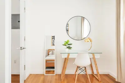 a dressing table with a mirror and a stool at 13-3 I Brand New 4BR 3 Baths Duplex Private Roof Deck in New York