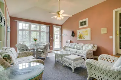 a living room with furniture and a table at Lancaster Vacation Rental Near Dutch Wonderland! in Lancaster