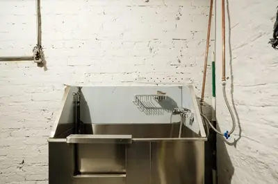 a stainless steel sink in a white brick wall at 74-1A New Studio in Prime UWS - GYM In Building in New York