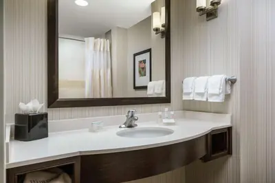 a bathroom with a sink and a mirror at Hilton Garden Inn Exton-West Chester in Exton