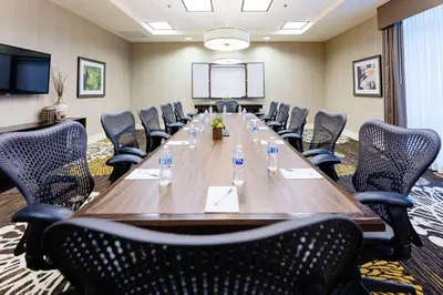 a large conference room with a long table and chairs at Hilton Garden Inn Exton-West Chester in Exton