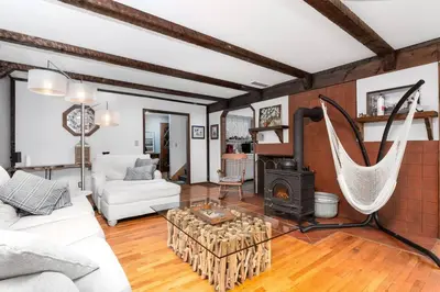 a living room with a couch and a stove at Breathtaking views. Hot tub. Huge Deck. Fast Wifi in Andes