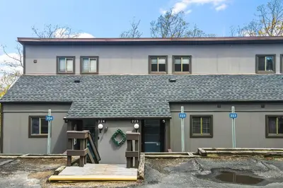 a large house with a garage in front of it at Tannersville Tranquility in Tannersville
