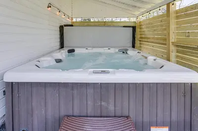 a jacuzzi bath tub in a shed at Hot Tub and Lake Access at Poconos Getaway! in Lake Ariel