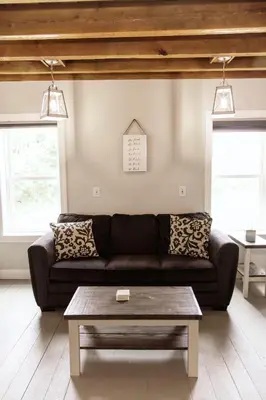 a living room with a couch and a coffee table at Valley View Cabin in Morris