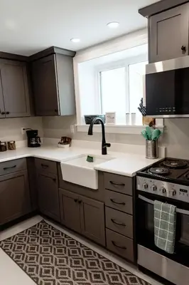 a kitchen with a sink and a stove at Valley View Cabin in Morris