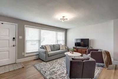 a living room with a couch and a tv at Renovated 2 BR home close to Lancaster attractions in Lancaster