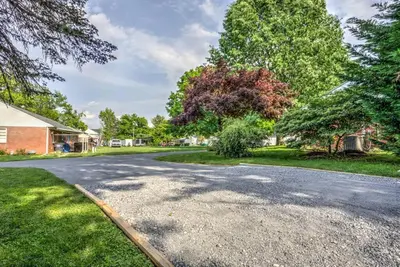 a driveway in a residential neighborhood with trees at New cozy home near Outlets & Amish Country in Lancaster