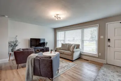 a living room with a couch and chairs and a tv at New cozy home near Outlets & Amish Country in Lancaster
