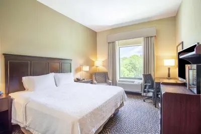 a hotel room with a bed and a window at Hampton Inn Philadelphia/Voorhees in Voorhees
