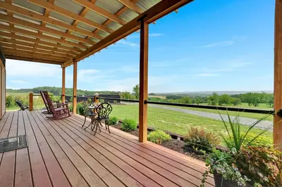 a wooden deck with a view of a field at Pine Grove Scenic View Unforgettable Love Getaway in Pine Grove