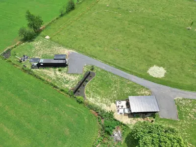 an aerial view of a farm with a road in a field at Pine Grove Scenic View Unforgettable Love Getaway in Pine Grove