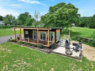 a tiny house with a porch and patio at Pine Grove Scenic View Unforgettable Love Getaway in Pine Grove