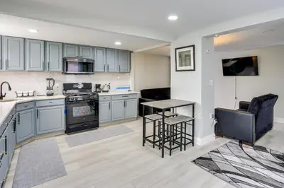 a kitchen with blue cabinets and a counter top at Jersey City Vacation Rental about 8 Mi to NYC! in Jersey City