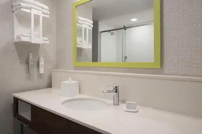 a bathroom with a sink and a mirror at Hampton Inn & Suites Somerset in Somerset