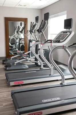 a row of cardio machines in a gym at Hampton Inn & Suites Somerset in Somerset