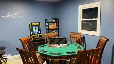 a dining room with a table with a laptop on it at Family retreat, Closest Rental House to POOL & BEACH, Hot tub, Game Room in Tobyhanna