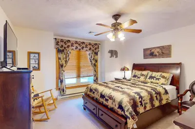 a bedroom with a bed and a ceiling fan at Northridge 197 in Tannersville