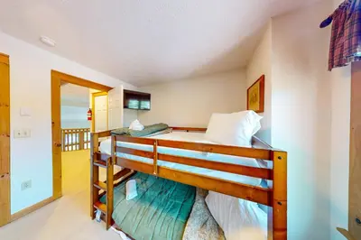 a bedroom with two bunk beds in a room at Northridge 197 in Tannersville