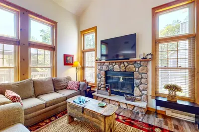 a living room with a couch and a fireplace at Northridge 197 in Tannersville