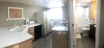 a small kitchen with a sink and a toilet at Cameron Estate Inn in Mount Joy