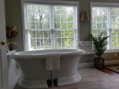 a bath tub in a bathroom with a window at Cameron Estate Inn in Mount Joy