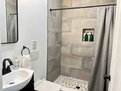 a bathroom with a shower and a sink at Secret Escape 20 Min from NYC N 1 in Jersey City