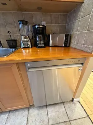 a kitchen counter with a counter top with a blender at Liberty Dream - 20 min to NYC in Jersey City