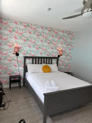 a bedroom with a bed with two towels on it at Sweet Home - 20 minutes to NYC in Jersey City