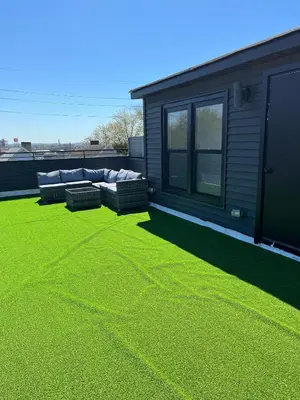 a lawn with two couches on top of a house at Secret Escape - 20 min from NYC N 2 in Jersey City