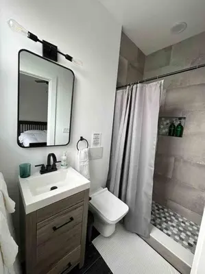 a bathroom with a sink and a toilet and a shower at Secret Escape - 20 min from NYC N 2 in Jersey City