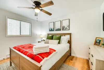 a bedroom with a bed and a ceiling fan at Deck and Community Perks Bright Pocono Lake Home! in Pocono Lake