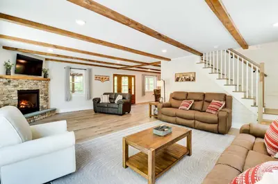 a living room filled with furniture and a fireplace at Pickleball Court and Fire Pit Milton Cabin! in Milton
