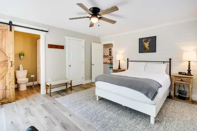 a bedroom with a bed and a ceiling fan at Pickleball Court and Fire Pit Milton Cabin! in Milton